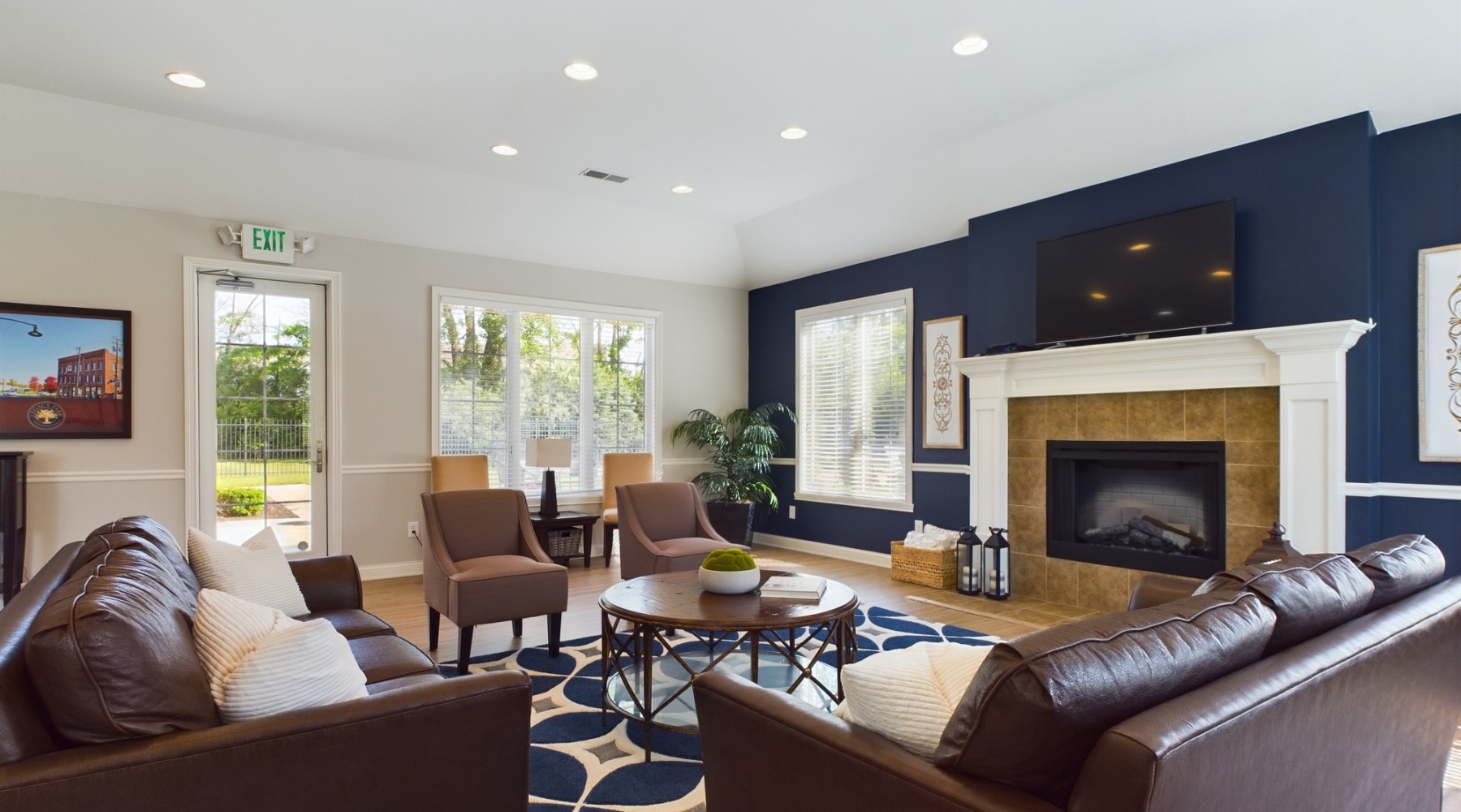 photo of clubroom with seating and fireplace