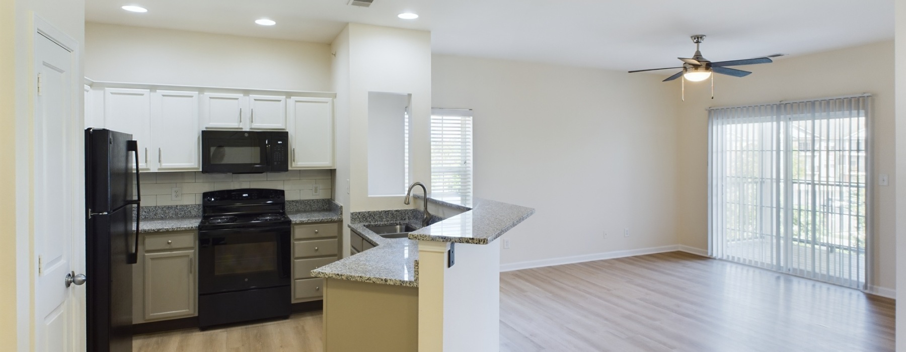 Upgraded Layout: Enjoy an Open Floorplan kitchen with appliances and living room space